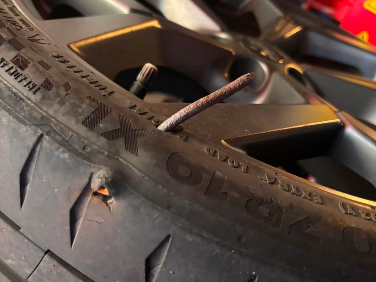 A set of new all season tyres ready for fitting
